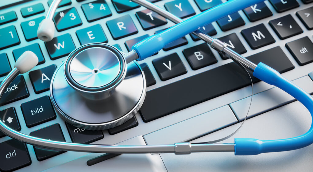 Stethoscope on laptop keyboard.